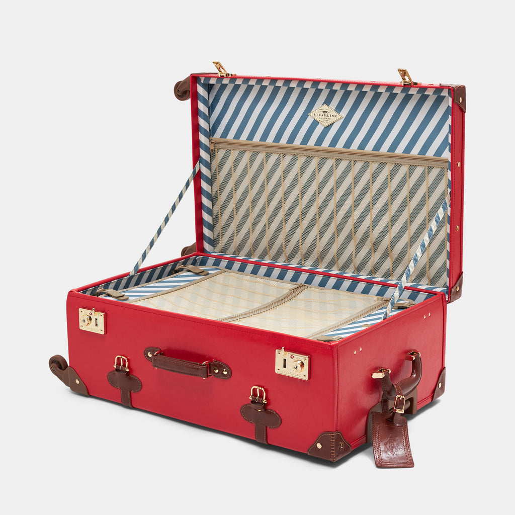 Red suitcase with open lid showing striped interior on a light gray background