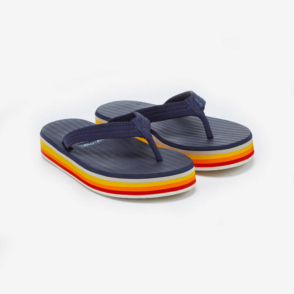 Navy flip-flops with colorful striped sole on a white background