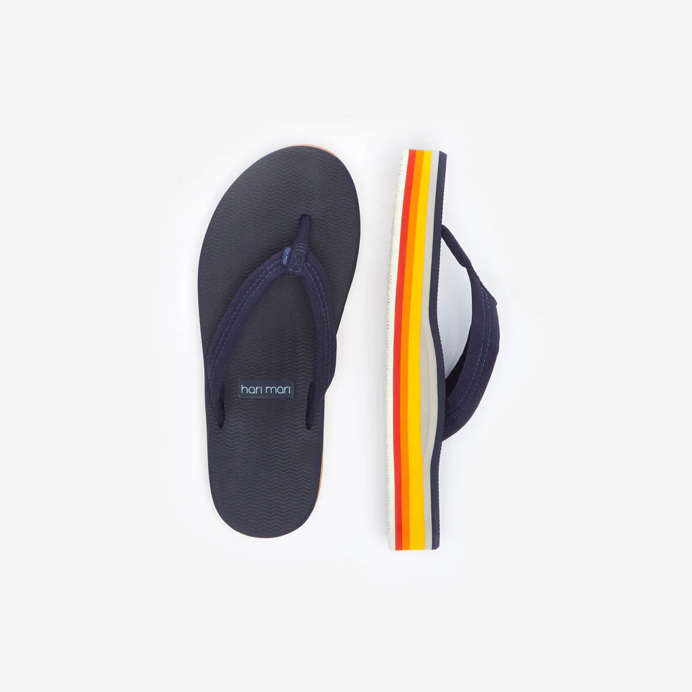 Navy flip-flop with a colorful sole on a white background